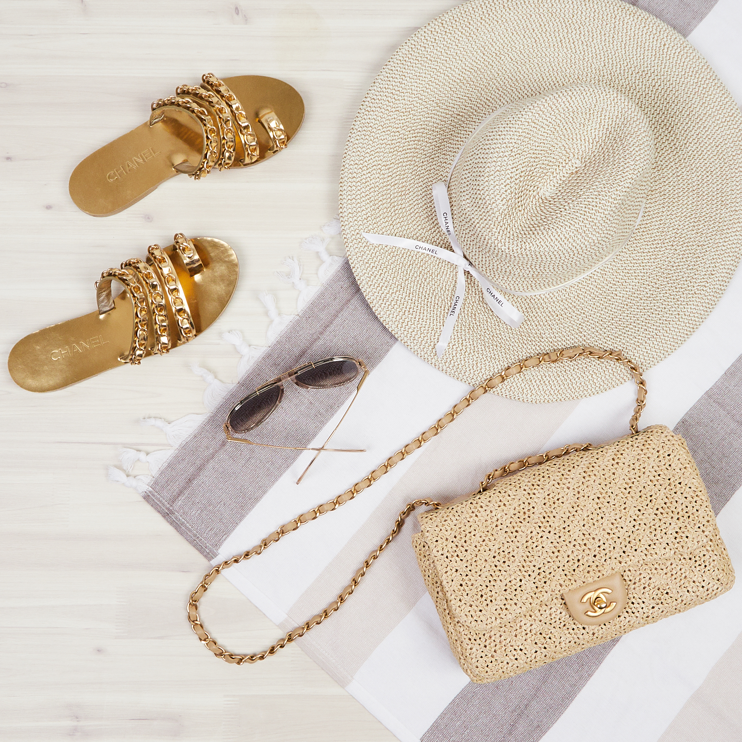 The iconic Chanel look for a resort getaway in the French Riveria: Chanel straw hat, Classic Flap bag, sunnies, and sandals | Shop Authenticated Pre-Owned Luxury Chanel at Yoogi's Closet